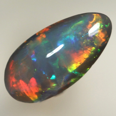 SOLID BLACK OPAL Bright rolling flashes over a medium high dome